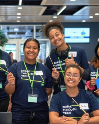 Five students pose for a photo. All students are wearing a Break Through Tech t-shirt.