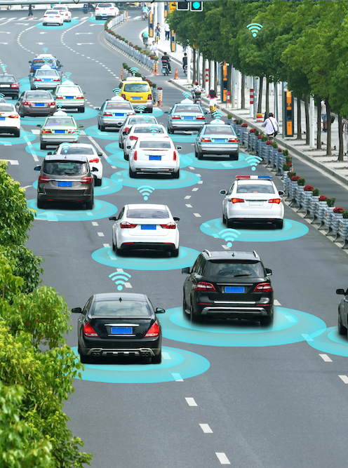 Illustration of autonomous vehicles driving on a tree-lined highway