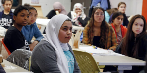 Female students from various racial, ethnic, and religious groups learn together in a UIC computer science classroom during a Saturday workshop