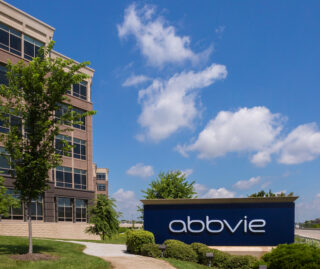 View of the company logo sign in front of AbbVie's headquarters in Lake Forest, IL