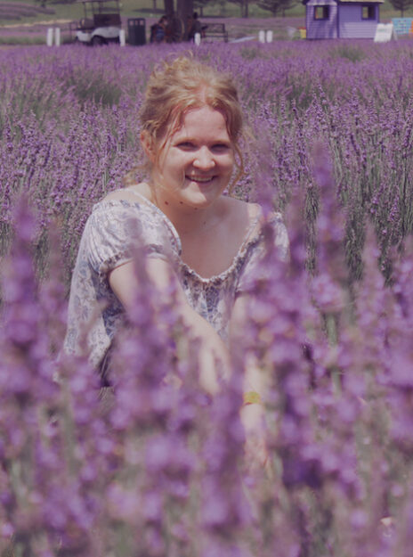 UIC computer science and linguistics major Grace Pnacek in a field of lavender flowers