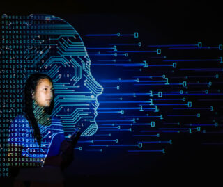 Artistic depiction of a female UIC student inside a blue and green projection of binary code in the shape of a person's profile
