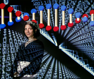 UIC data science student Linda Mansour in front of a representation of biological data