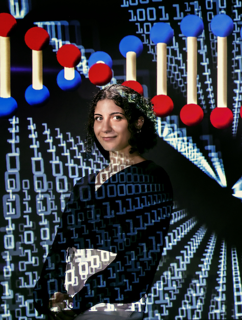 UIC data science student Linda Mansour against a representation of biological data