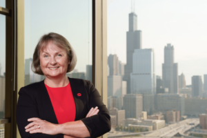 portrait photo of Karen Colley with the Chicago skyline in the background